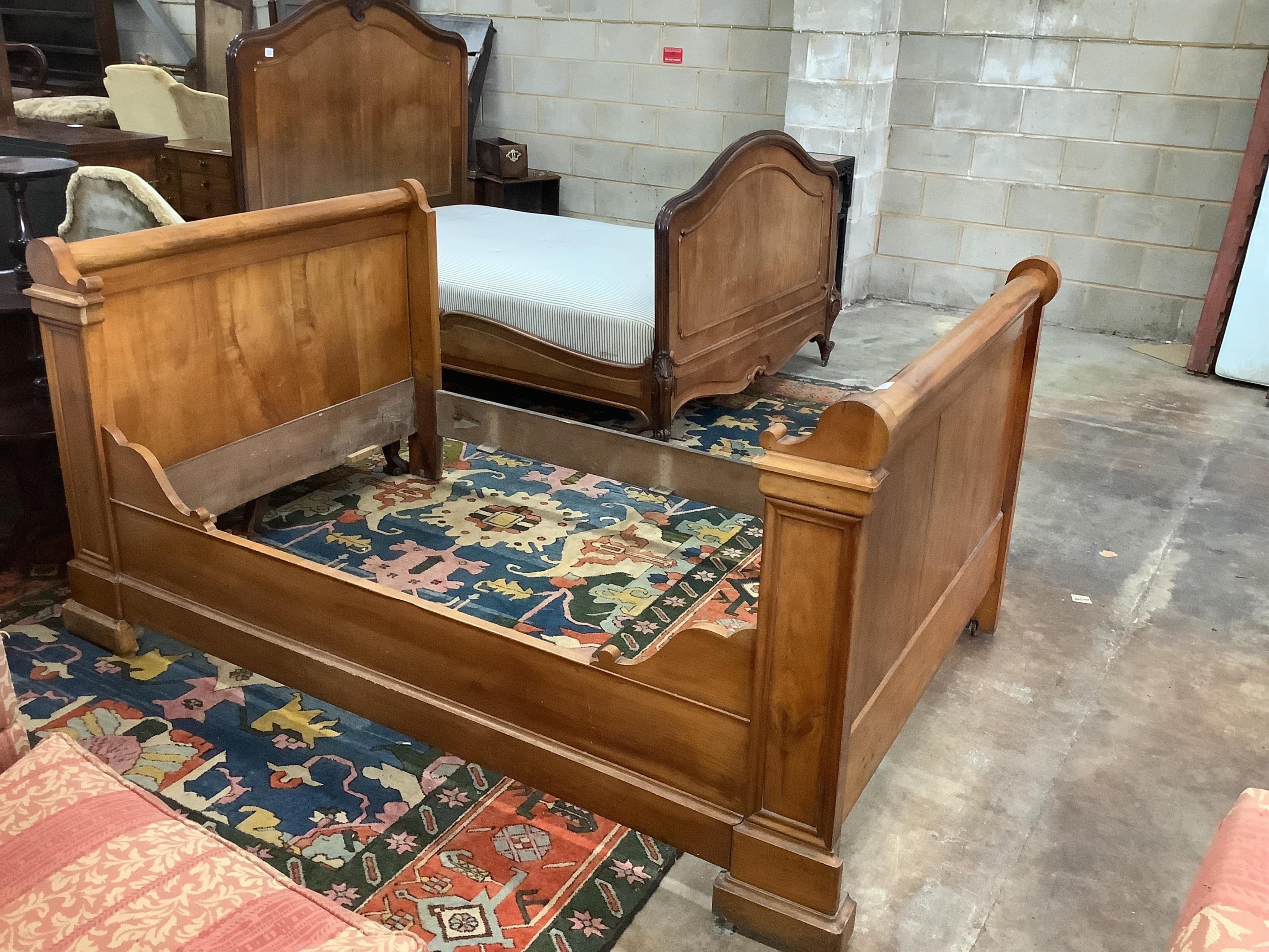 A 19th century French carved walnut sleigh bed, width 130cm, length 202cm, height 100cm. Condition - fair